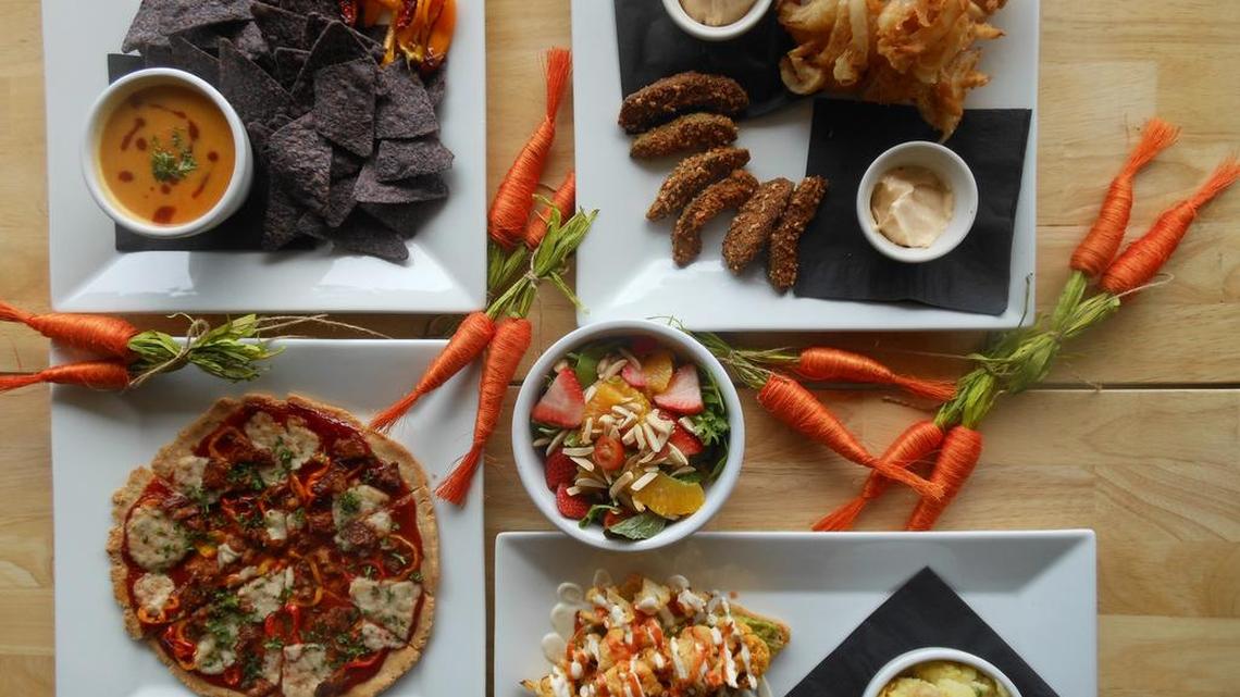 Potato and carrot ‘cheese’ dip with blue corn chips and roasted peppers, gluten-free pizza with vegan cheese and tempeh BBQ, avocado fries crusted in coconut and ground almonds, Buffalo cauliflower and avocado toast with a side of mashed potatoes at Clovermint, Dania Beach.