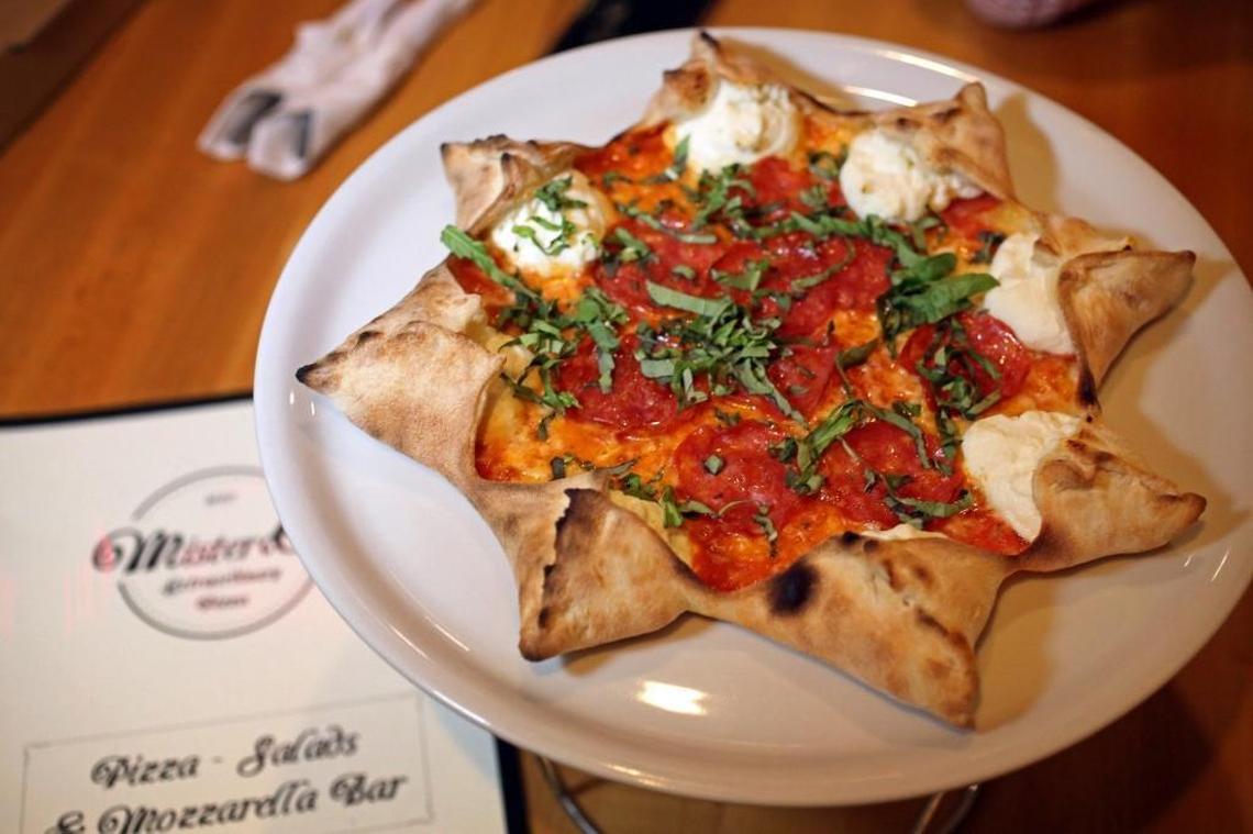 The famous Star Luca pizza at Mister O1 Extraordinary Pizza in Miami Beach. The small pizzeria became a huge hit despite being buried inside an office building with no sign out front. That has led to two other Mister O1 pizzerias, in Brickell and Wynwood in Miami.