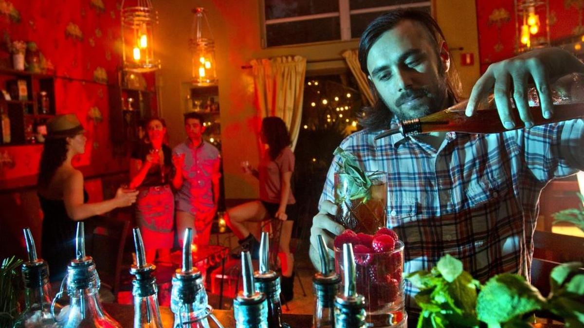 Co-owner Elad Zvi mixes a high end cocktail the Broken Shaker.