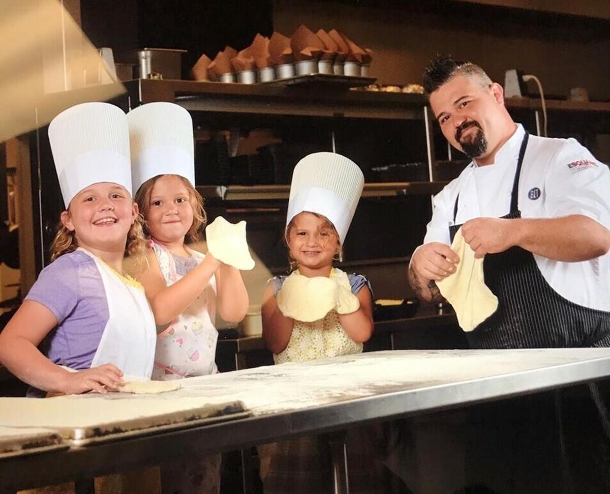 Chef Dustin Ward with daughters (left-to-right) Dahlia, Remi and Caden spend family time in the kitchen.