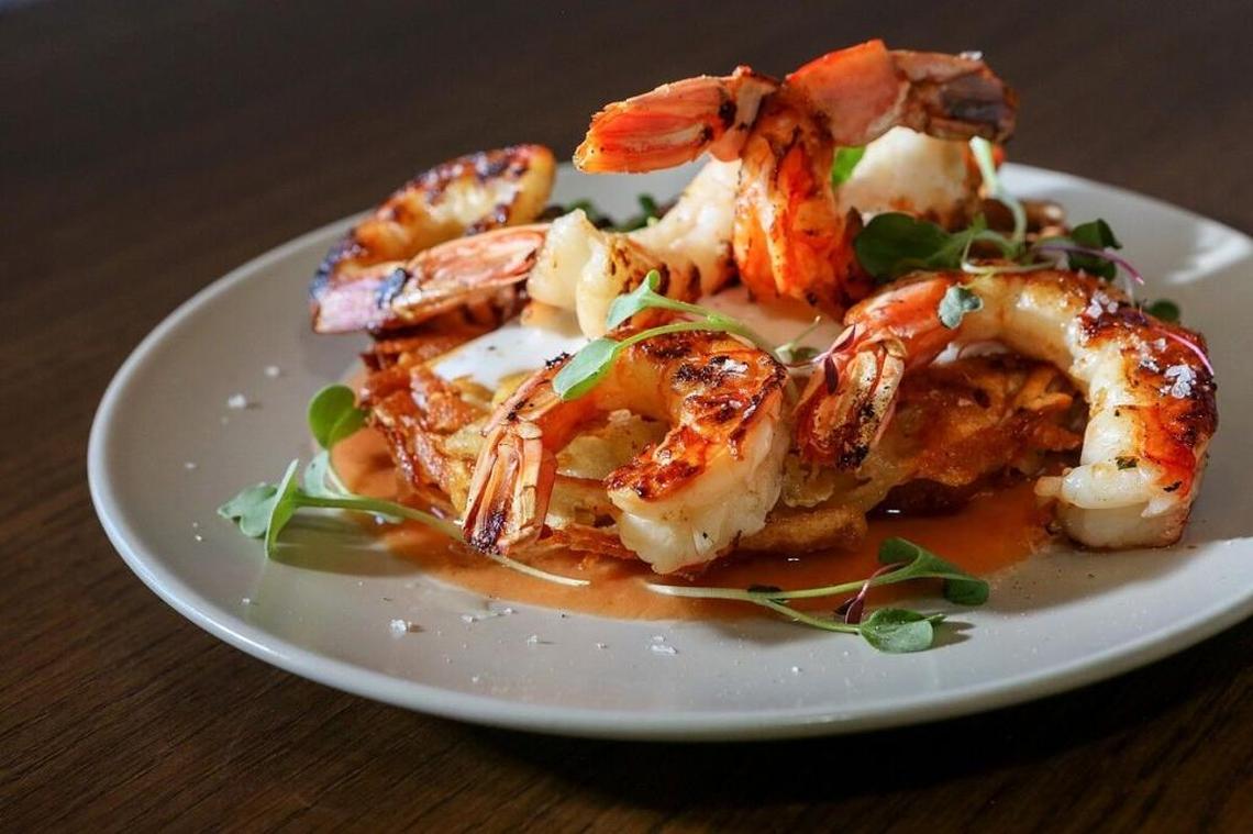 Grilled wild Argentine shrimp on a golden shredded potato rosti cake at Paon Eatery Tapas Bar.