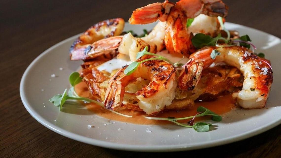Grilled wild Argentine shrimp on a golden shredded potato rosti cake at Paon Eatery Tapas Bar.