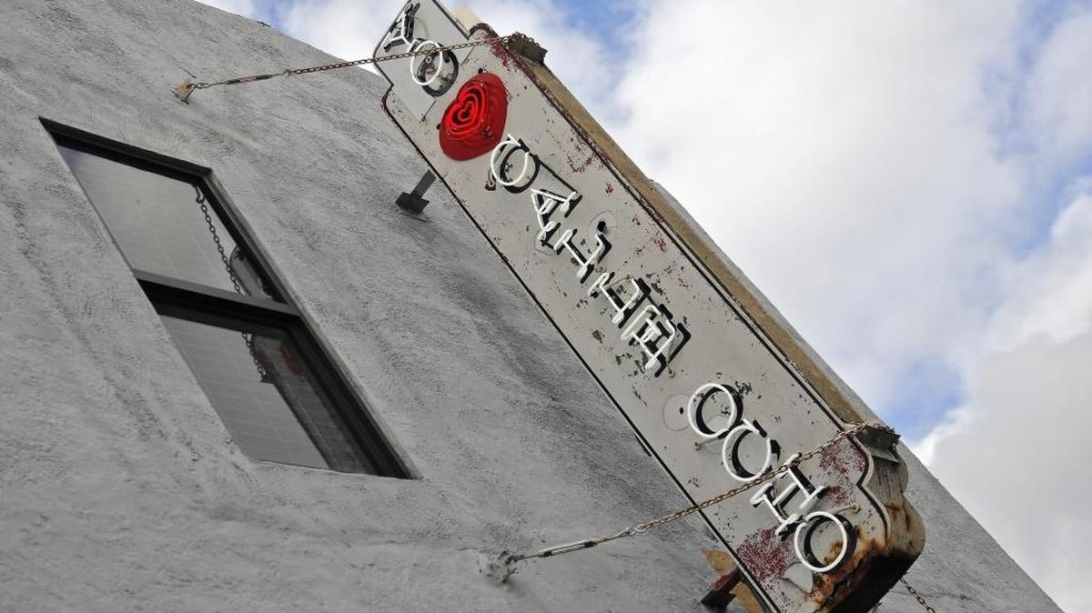 The sign over Union Beer Store lights up with the message that many new Calle Ocho business owners have adopted. A new courtyard with a new restaurant and a wine bar will open behind Union, connecting Eighth and Seventh streets.