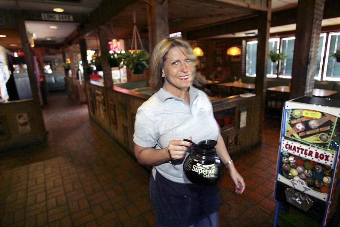 Waitress Kim Gentile serves customers coffee at the Davie Lums in 2005.