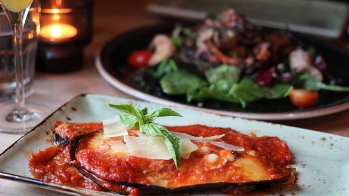 Baked eggplant, warm and homey and perfectly done, has plenty of Parmigiano-Reggiano and melted bocconcini, the rustic flavor array benefitting from an aggressively peppery tomato sauce