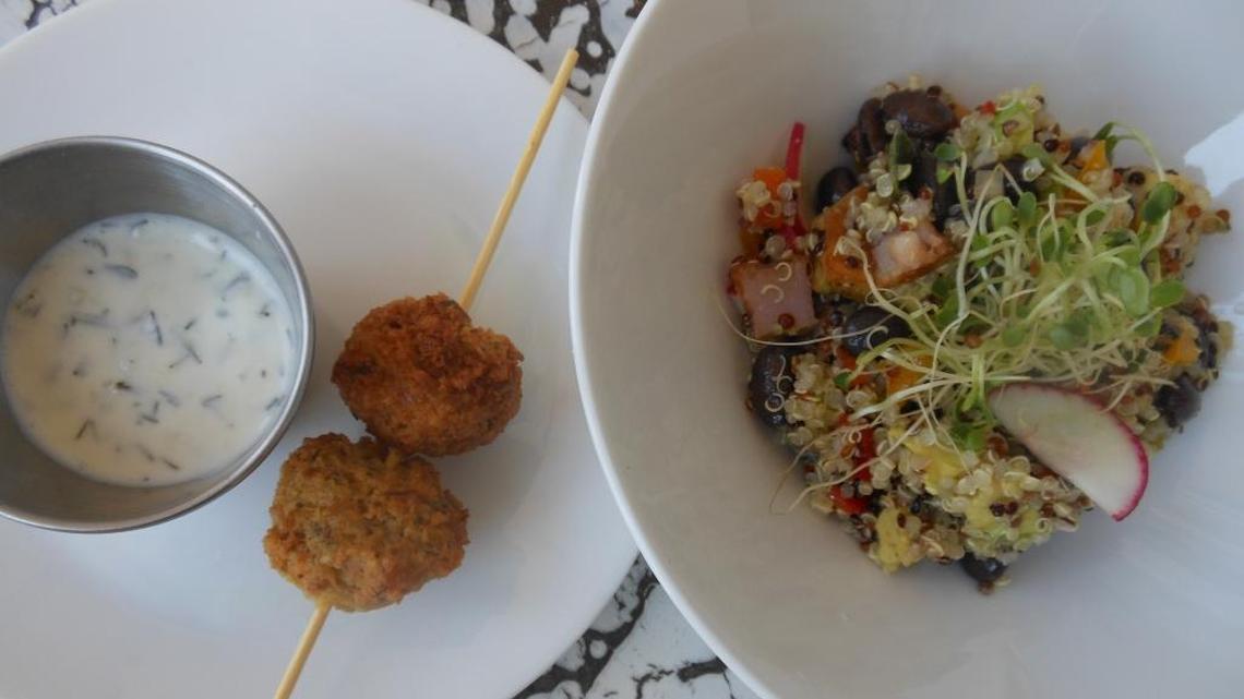 Mini falafel with yogurt mint dip and quinoa and black bean salad with radish, potato and avocado topped with sprouts at Lilikoi Organic Living, South Beach.