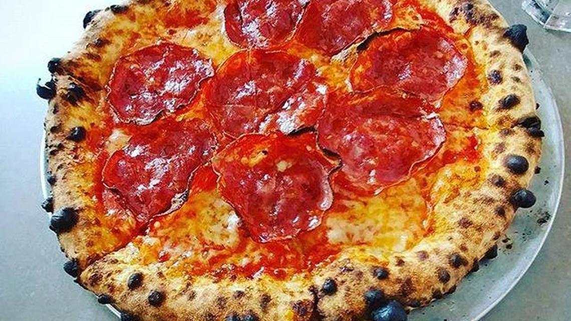 Paule Gee’s uses an Italian-built, 1,000 degree oven to cook its Neapolitan-style pizzas. In and out in 90 seconds, the crust remains doughy with big, black blisters that the untrained eye would see as burned.