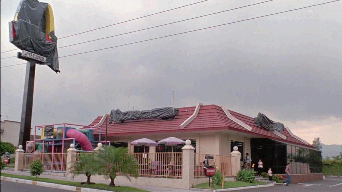 Signs outside this fast-food restaurant in San Salvador are covered following a judge's order on Aug. 30, 1997. A judge ordered a Salvadoran fast-food chain to cover up all McDonald's markings in its six restaurants after the U.S. burger giant sued the chain, saying it canceled its concession almost two years ago.