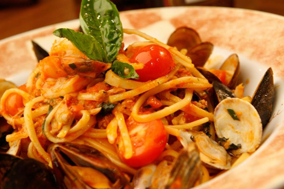 The linguini with clams, mussels, calamari and shrimp is plenty for two, the light tomato sauce nicely bathing the perfectly cooked seafood and al dente pasta.