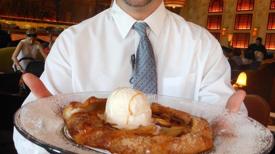 Manager Louis Migacz with apple pie a la mode at Grand Lux Cafe, Aventura.