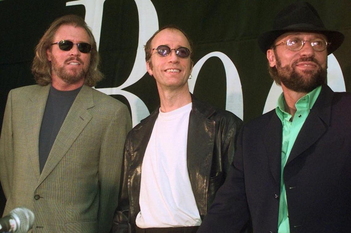 This July 29, 1998, file photo shows brothers Barry, Robin and Maurice Gibb, left to right, of the Bee Gees during a news conference in Miami Beach. Maurice died in 2003, and Robin died in 2012.
