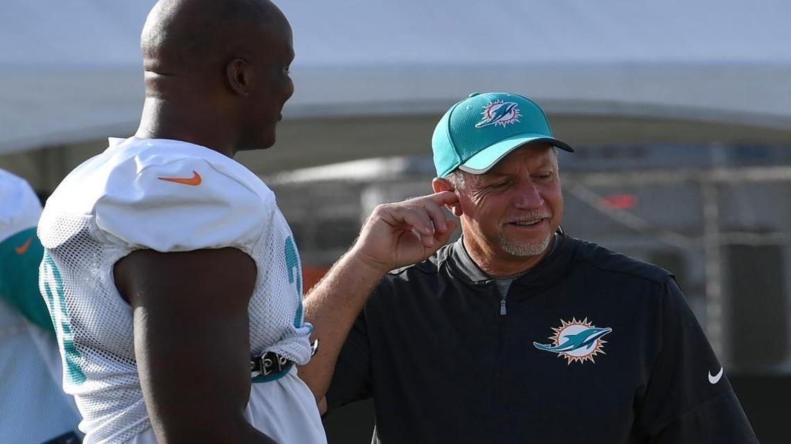 Chris Foerster speaks with Miami Dolphins Tackle #70 Ja'Wuan James during practice back in August 2017. Foerster resigned as Dolphins offensive line coach Monday, October 9, 2017, after video was released by a Las Vegas model of him apparently doing lines of cocaine.