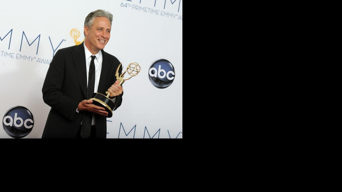 
 In this Sept. 23, 2012 file photo, Jon Stewart, winner Outstanding Variety Series for The Daily Show With Jon Stewart, poses backstage at the 64th Primetime Emmy Awards in Los Angeles. Comedy Central announced Tuesday, Feb. 10, 2015, that Stewart will will leave "The Daily Show" later this year. 
