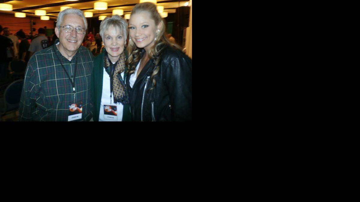 
Florida gal Kristen Renton (right) of “Sons of Anarchy” fame with her parents (Jack and Edie) after she participated in the Ronin Pro Wrestling Show on Jan. 17 during the Magic City Comic Con at the Miami Airport Convention Center.
