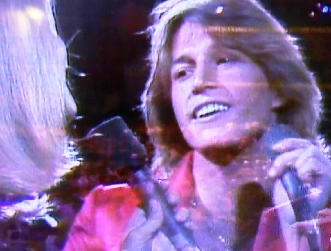 Andy Gibb and Olivia Newton-John sing the Bee Gees’ “Rest Your Love on Me” from a 1979 UNICEF television special in this screengrab from CBS’ broadcast of “Stayin’ Alive: A Grammy Tribute to the Bee Gees” on Sunday, April 16, 2017.