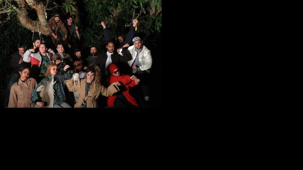 
Members of the Borscht Corp. pose outside their office in North East Miami. The group is a collection of artists, filmmakers, photographers and creators who collaborate every other year on the Borscht Film Festival, soliciting submissions from aspiring Miami filmmakers, picking projects on merit, then helping to make them by providing everything from equipment to actors to lights.
