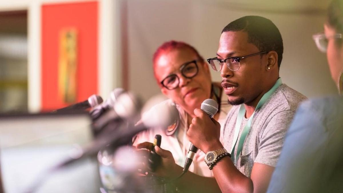 Rosie Gordon-Wallace, left, of Diaspora Vibe Gallery, and Germane Barnes, artist and city planner for Opa-locka, at a panel on gentrification at Common Field Miami.