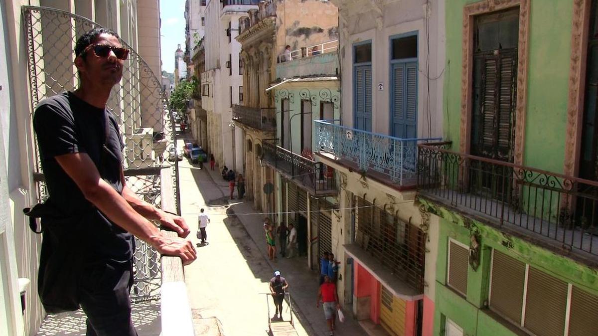 
Cuban-American, Miami-based artist Leyden Rodriguez-Casanova on the balcony of the Factoria Habana.
