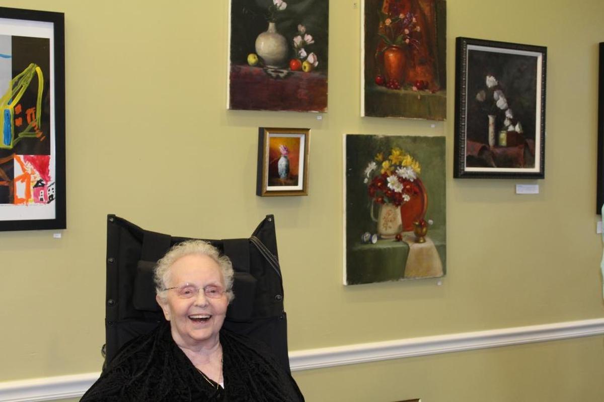Miami Jewish Health resident Rose Kove displays her art as part of the healthcare facility’s ‘Miami Jewish Basel’ event on Dec. 4, 2017.​