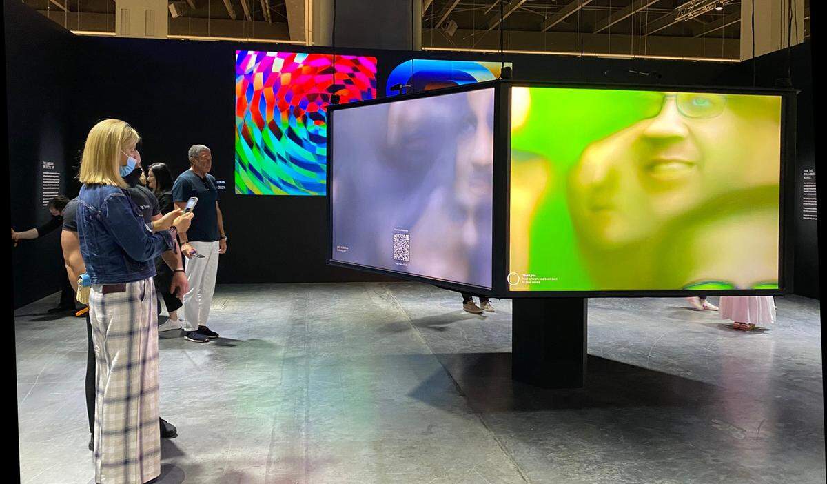 At Art Basel Miami Beach 2021, collectors explore digital works — known as NFTs — presented by the Tezos platform.