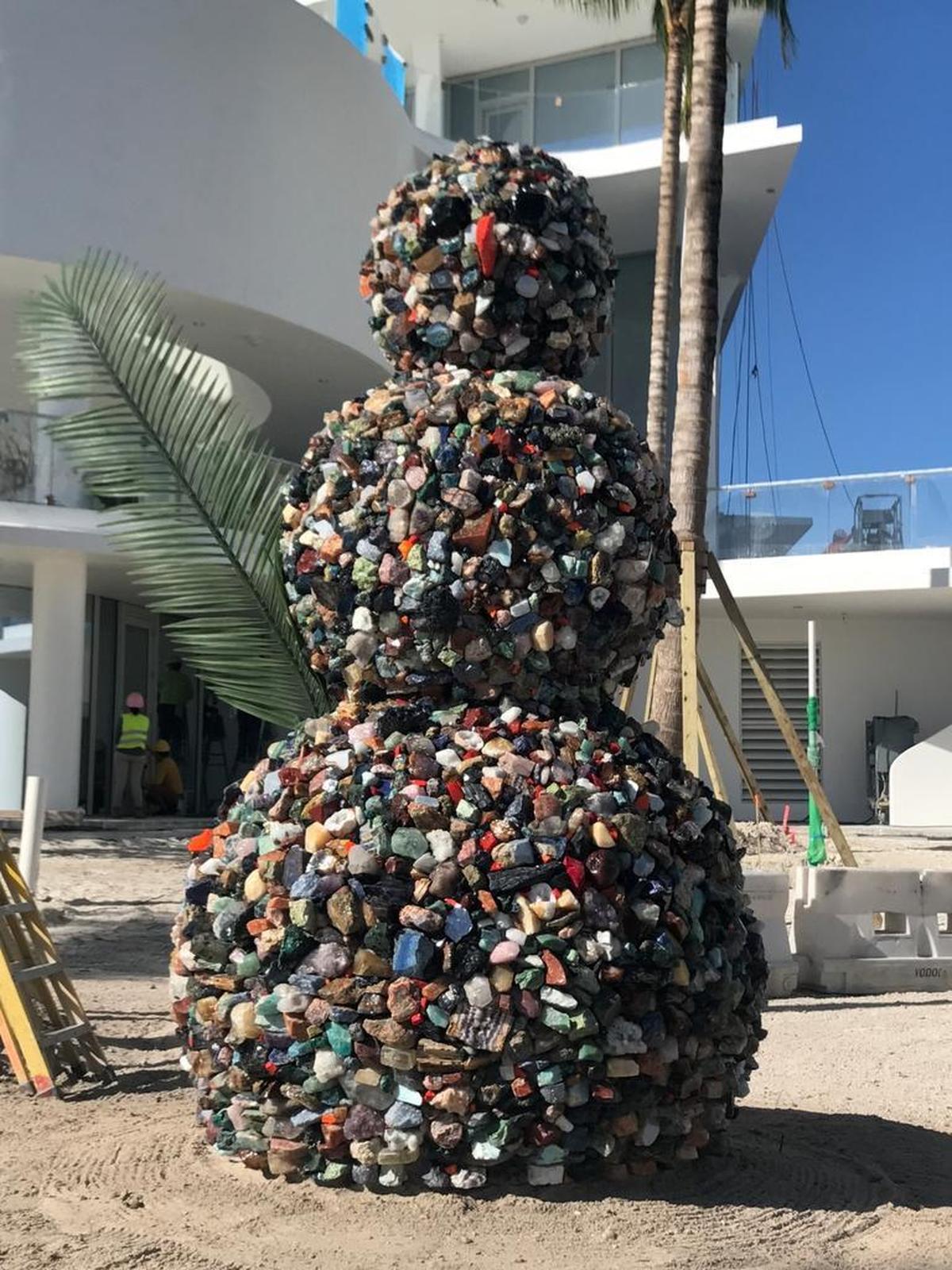 Artist Daniel Knorr’s “Snowman” covered in gemstones at Jade Signature.