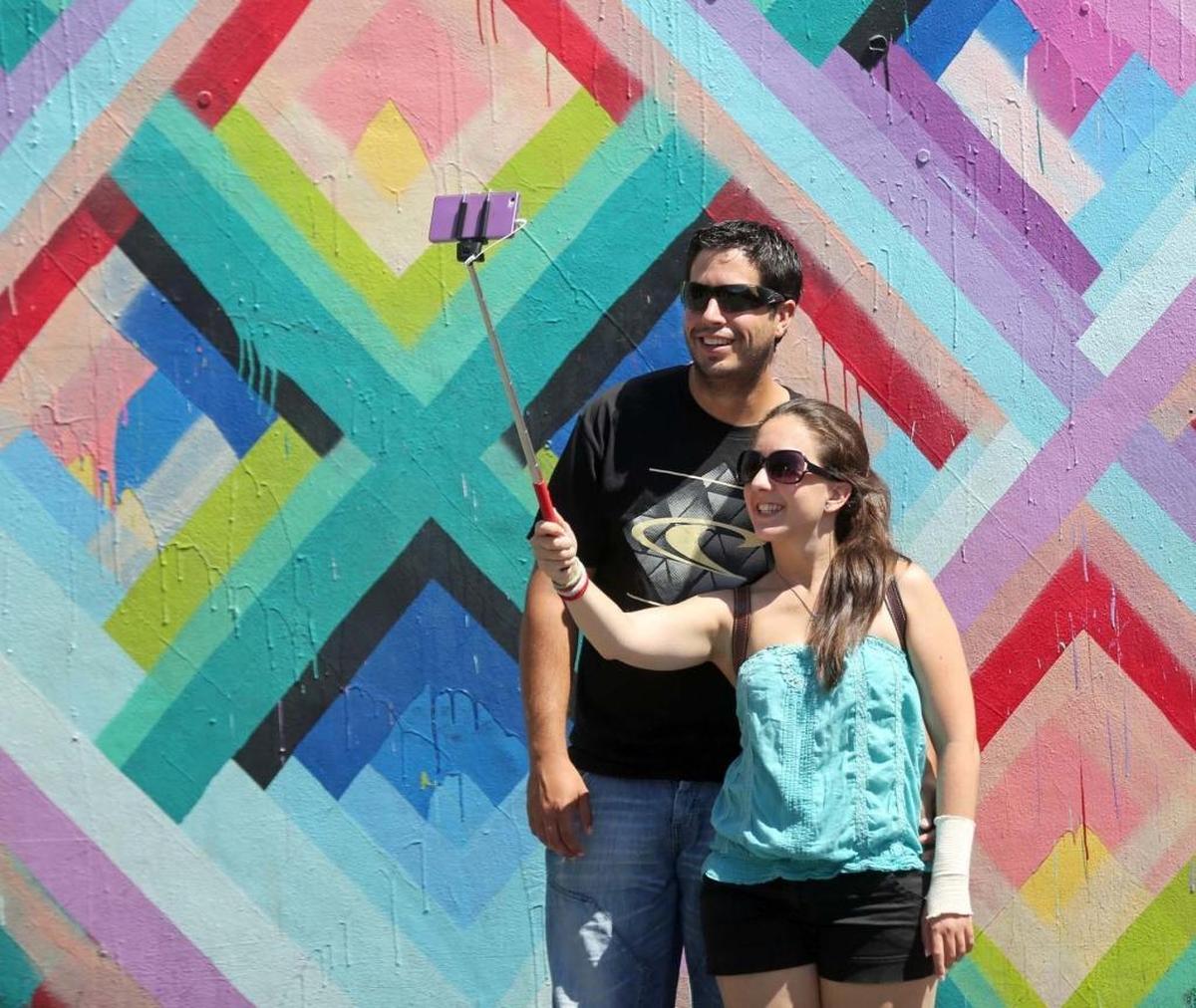 Wynwood Walls again will unveil more than a dozen new walls by renown street artists. The setting is popular with tourists, as in this 2016 photograph.