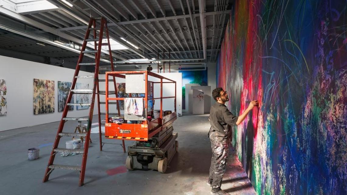José Parlá working on his piece, “Nuevo Rumbo,” a 6-foot by 24-foot painting of Cuba’s history, in his studio in Brooklyn.