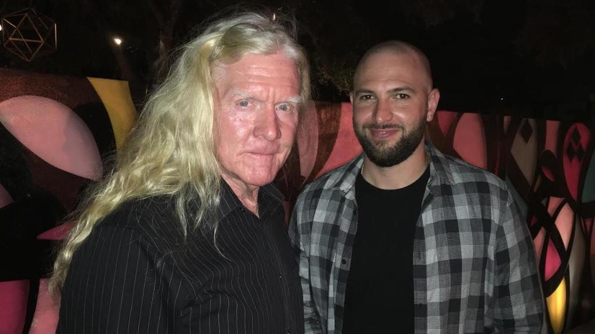 Former cocaine cowboy Mickey Monday and artist partner Maurizio Raponi at Wynwood Walls Tuesday night