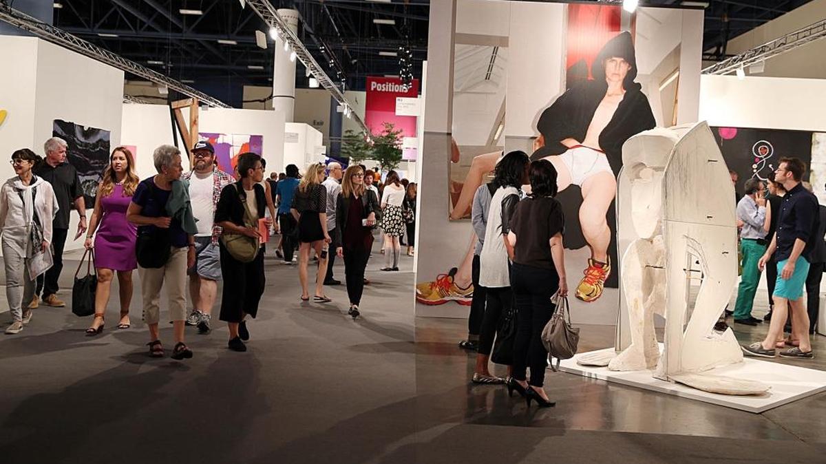 Fairgoers flooded the Miami Beach Convention Center during last year’s Art Basel opening in Miami Beach.