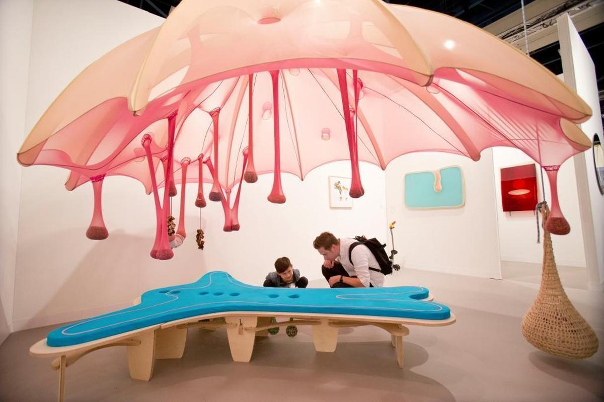Brian Alfred, right, and his son Naoki, then 7, came from Brooklyn to Miami Beach for Art Basel 2016. Here, they look at pieces by artist Ernesto Neto at the Convention Center.