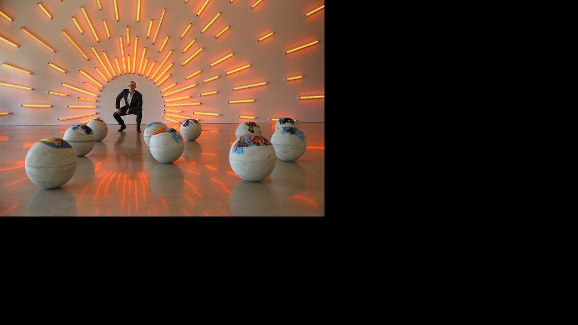 
Pérez Art Museum Miami director Thomas Collins gets a closer look at Mark Handforth’s light sculpture in the second floor gallery. The museum is celebrating its first birthday on Thursday, Dec. 4, 2014, just as Miami Art Week gets underway.
