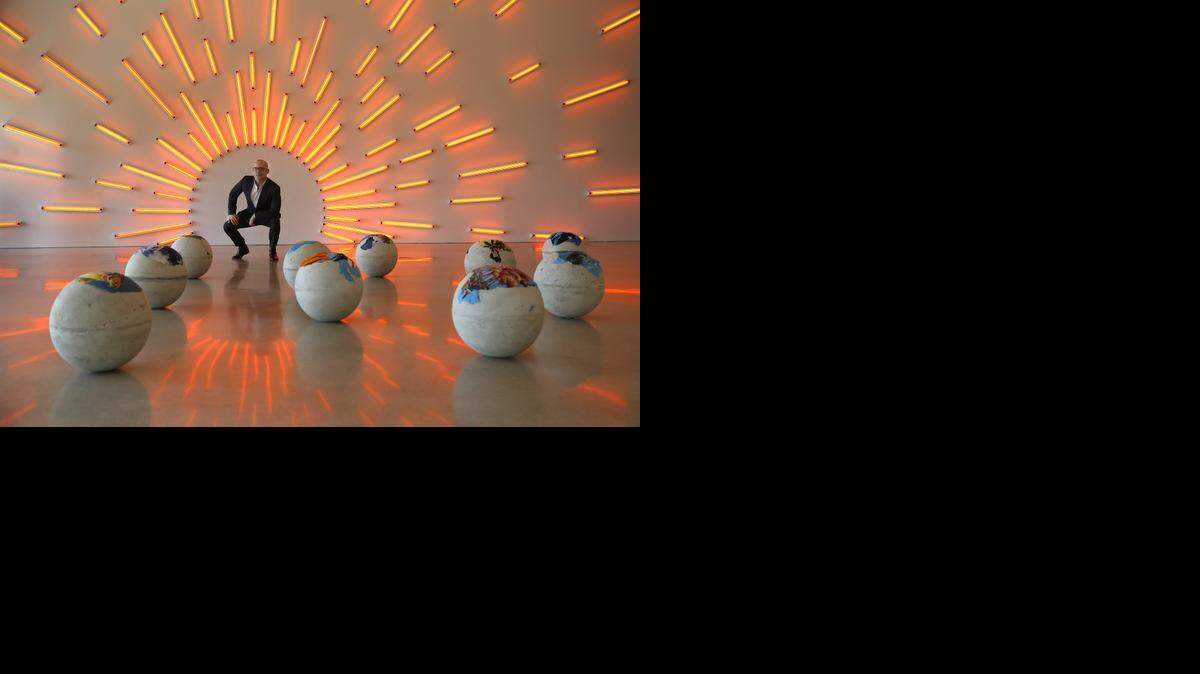 
Pérez Art Museum Miami director Thomas Collins gets a closer look at Mark Handforth’s light sculpture in the second floor gallery. The museum is celebrating its first birthday on Thursday, Dec. 4, 2014, just as Miami Art Week gets underway.
