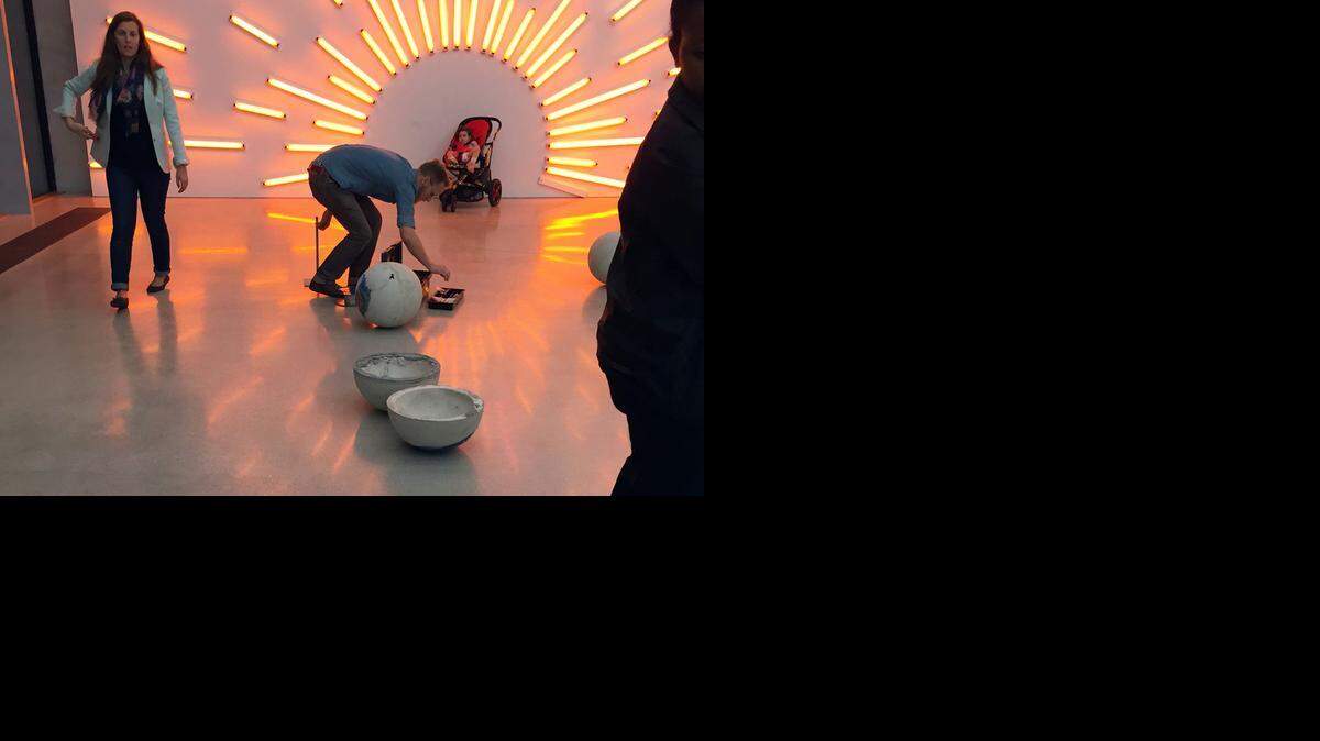 
Gean Moreno and Ernesto Oroza's work "Drywood" — 12 concrete spheres nestled on the floor, each with a beach towel meshed into them — was damaged by accident Thursday evening, according to the Pérez Art Museum Miami.
