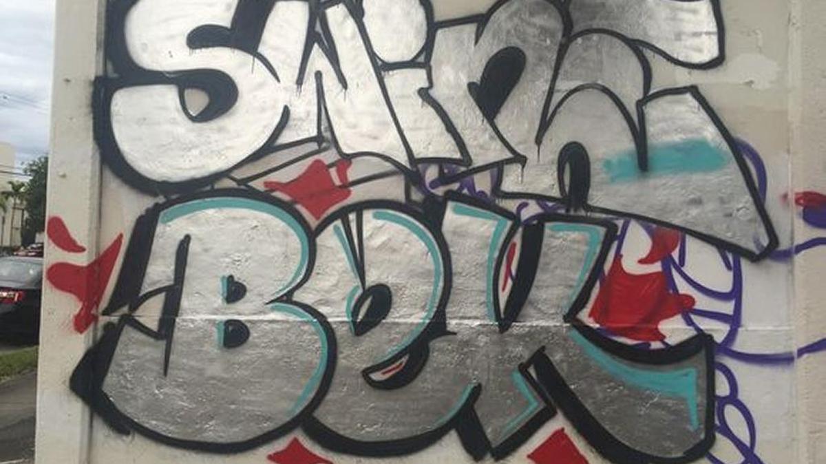 Two men were arrested Friday afternoon at Wynwood art fair for tagging this building near Northwest 29th Street and Fifth Avenue.