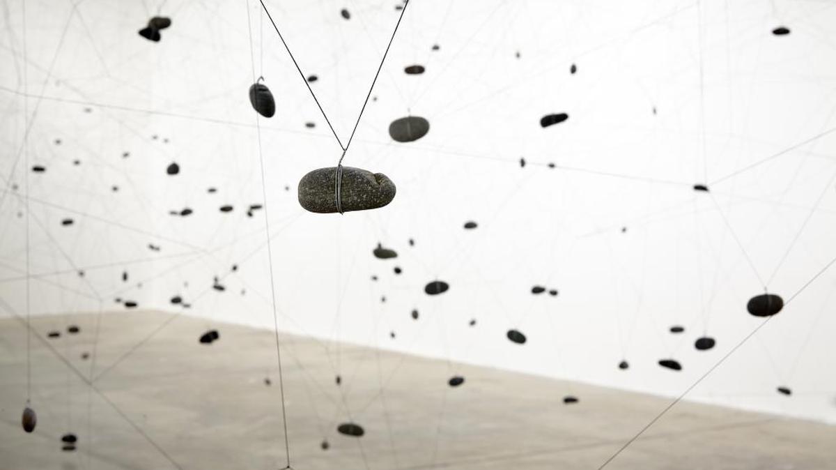 The “Vilos” installation ties threads and weights them with stones, filling an entire room. From “Tramas,” solo exhibition of work by Gustavo Pérez Monzón at CIFO through May 8, 2016.