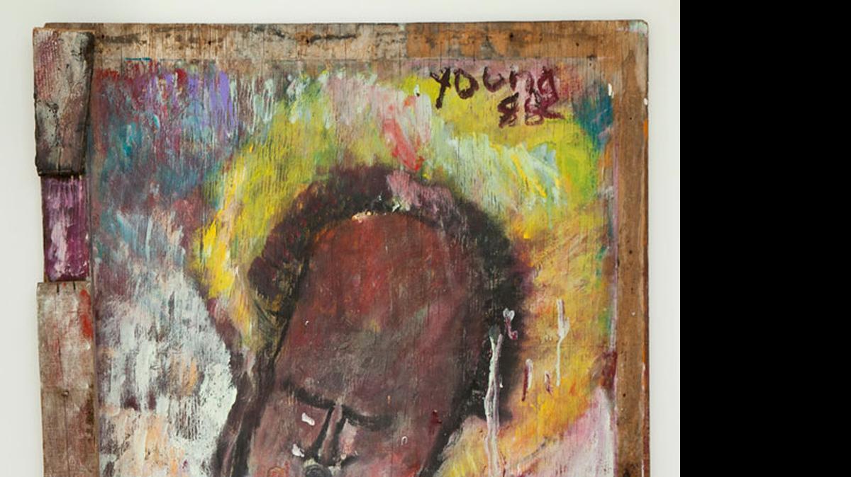 
Purvis Young’s ‘Big Head’ is on display in Miami Dade College’s Martine and Pat Fine Center for the Arts.
