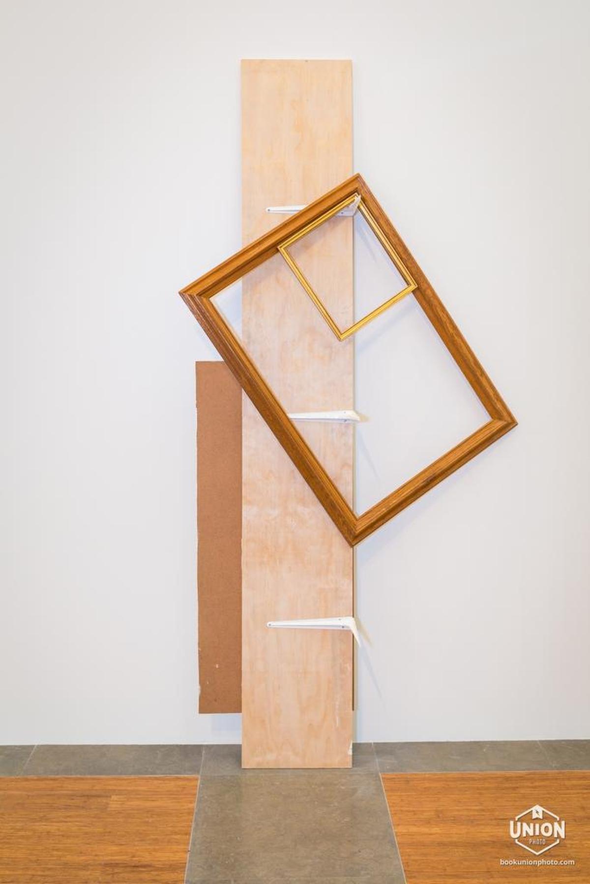 ‘A Shelf Supporting Two Frames, 2017,’ Leyden Rodríguez Casanova (b. 1973, Havana, Cuba; lives in Miami), wood, aluminum, and steel.