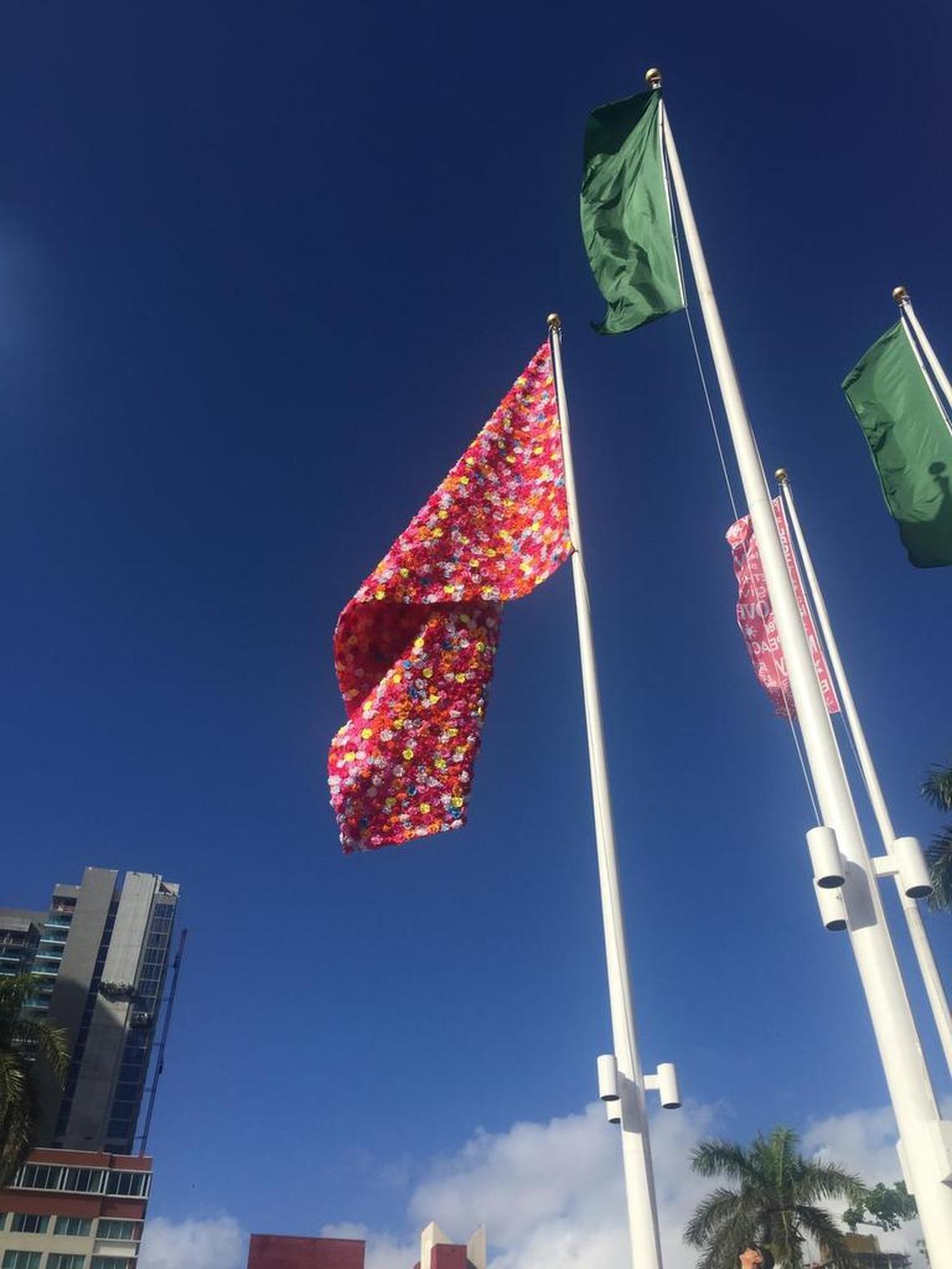 “Flower Power” by Roberto Behar & Rosario Marquardt (R&R Studios), flag with silk flowers.