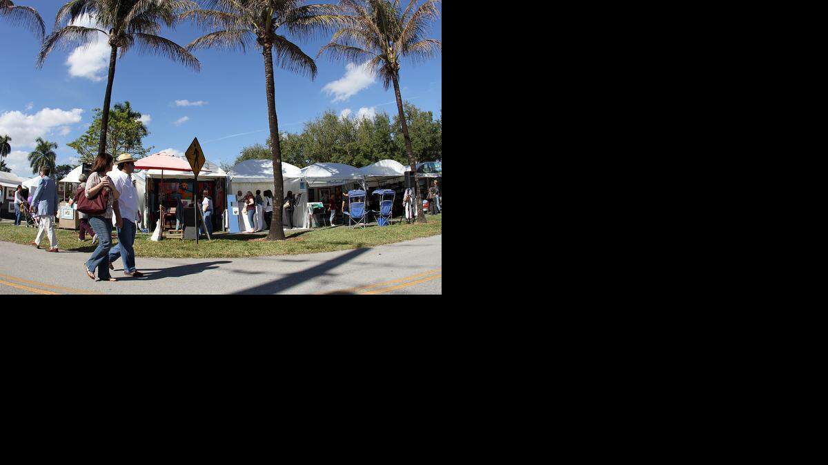
Art lovers walk through tents at the 60th annual Beaux Arts Festival at the University of Miami in Coral Gables on Jan. 9, 2010. The festival will celebrate its 64th year with its two-day event on Jan. 17 and 18.
