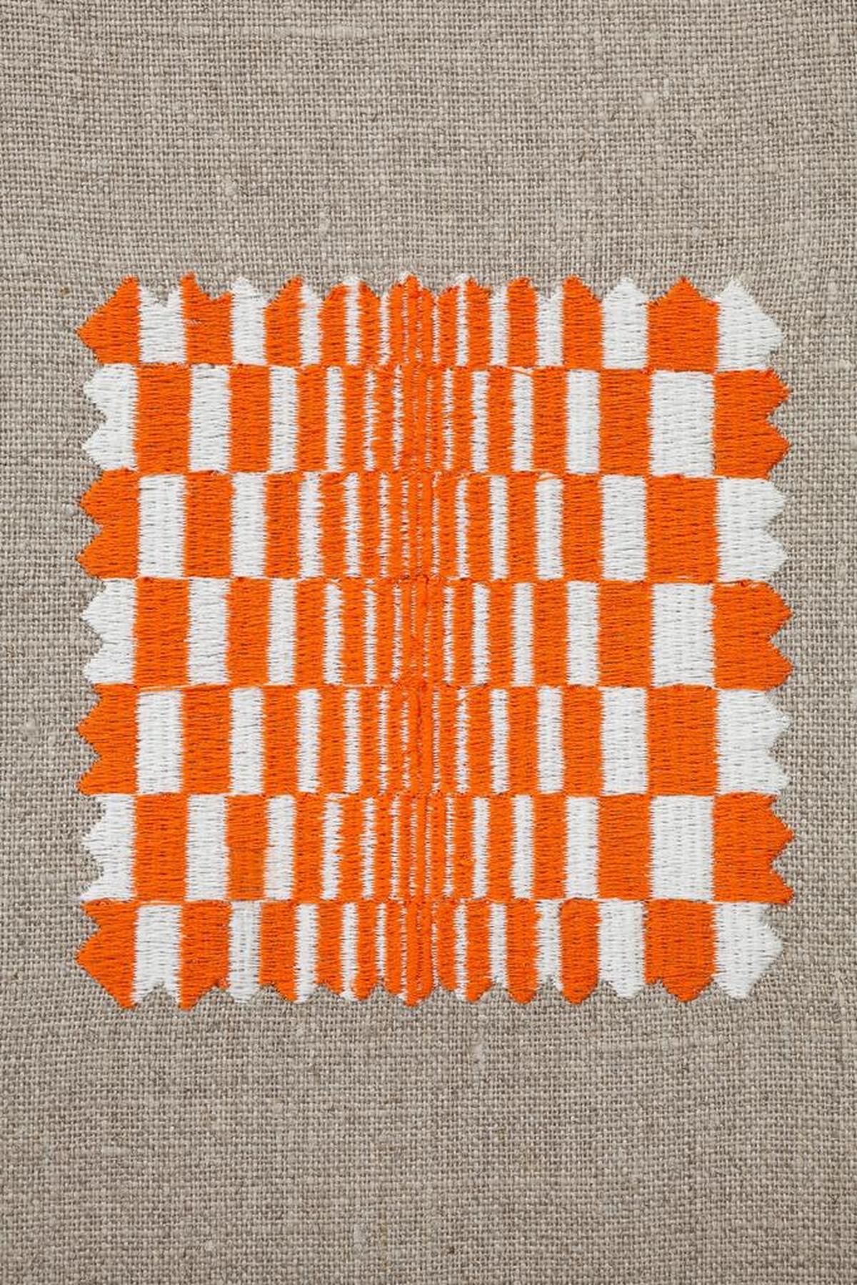A woven square by Elaine Reichek from ‘Swatches: Riley 1-4,’ is on display through Dec. 29, 2017, as part of the ‘Threads of Execution’ show at the Dimensions Variable art space.