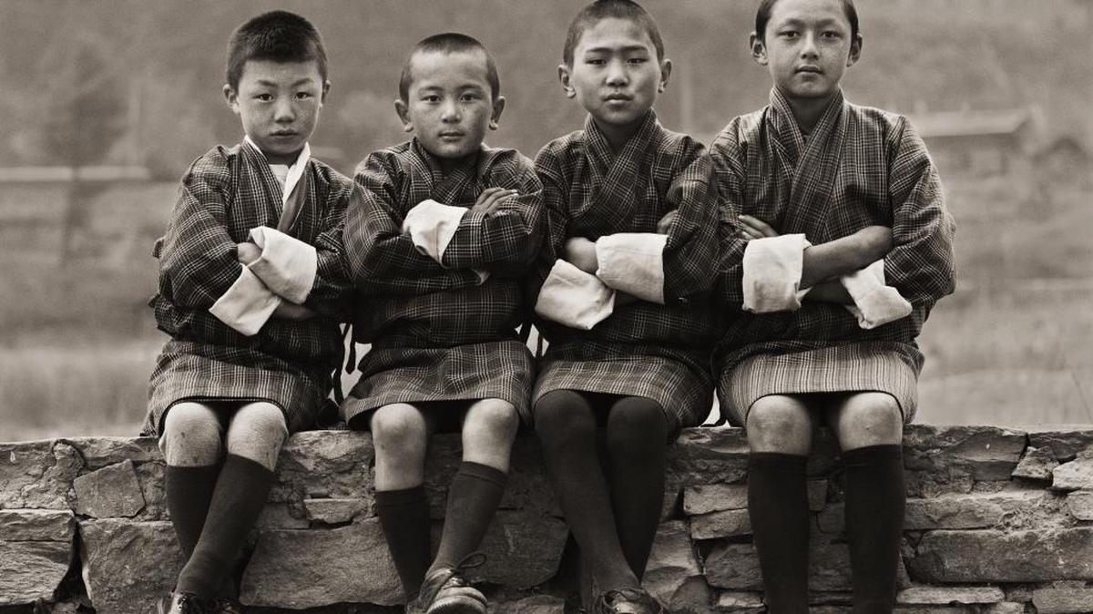 “School Boys in Bhutan,” 2010. From the show “DIGNITY: Tribes in Transition,” photographs by Dana Gluckstein, at the Lowe Museum of Art through April 22, 2018.
