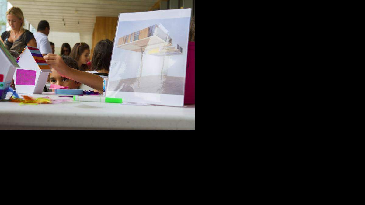 
Natalia Flores, 8, takes part in a arts workshop Saturday, Sept. 13, 2014, at PAMM museum, which hosts events geared at young artists every second Saturday of each month. 
