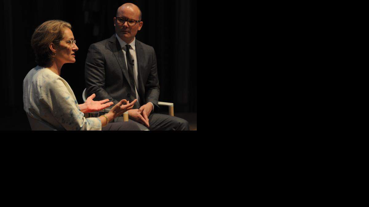 
Lisa Erf, director of the JPMorgan Chase Art Program, speaks to PAMM director Thom Collins at the museum’s corporate luncheon Monday.
