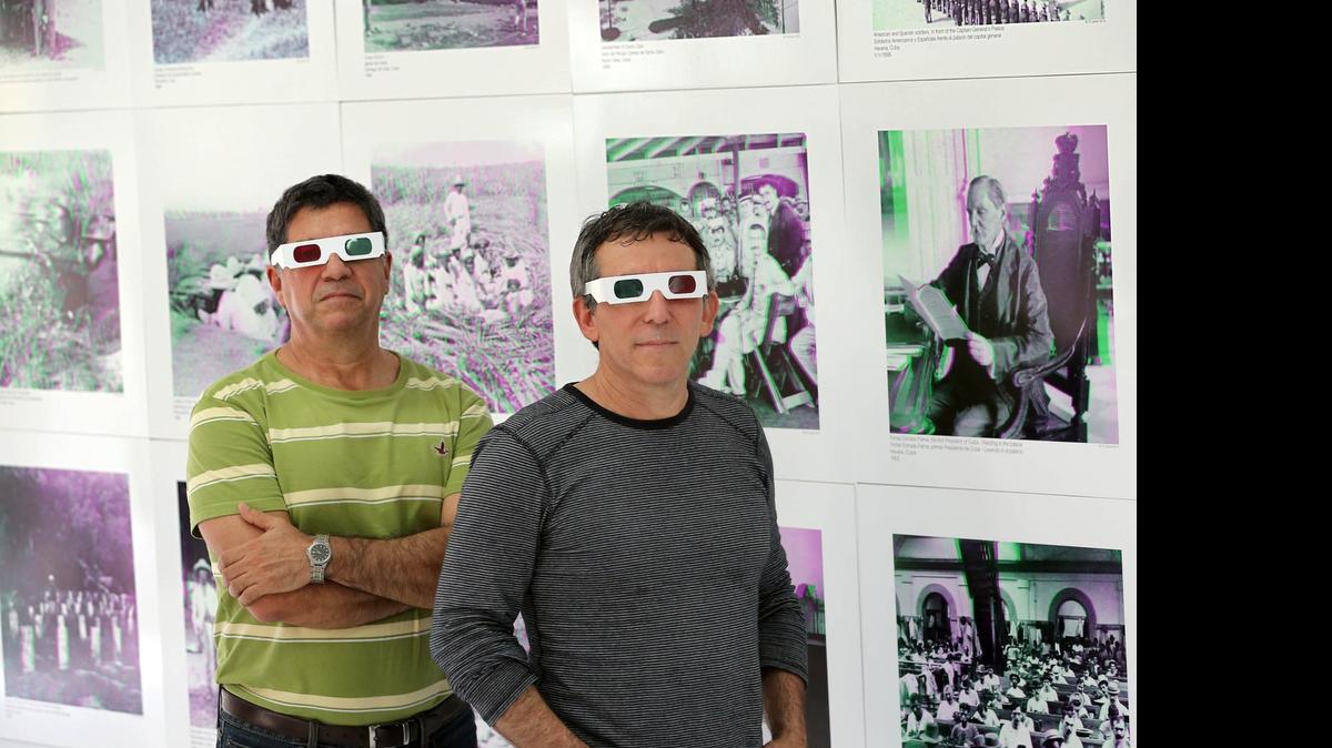 New look:  Ricardo Mutuberría, left, and Dr. Plinio Hurtado put together the ‘Republic of Cuba, birth of a nation’ exhibit of historic 3-D images, on display in Coral Gables.