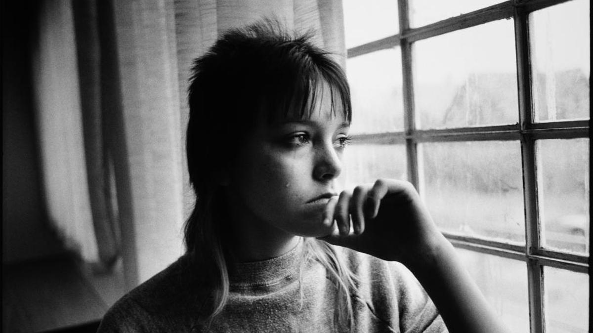 Tiny looking out a window in juvenile detention, 1983