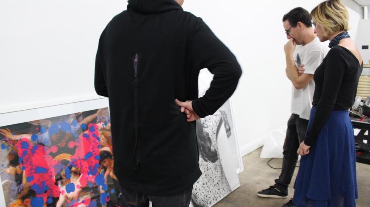 FU Gallery owners Miguel Ullivarri and Valeria Fiñana with artist Ciler selecting some of the final pieces for ‘Ponzoña,’ his first solo exhibit in the United States.