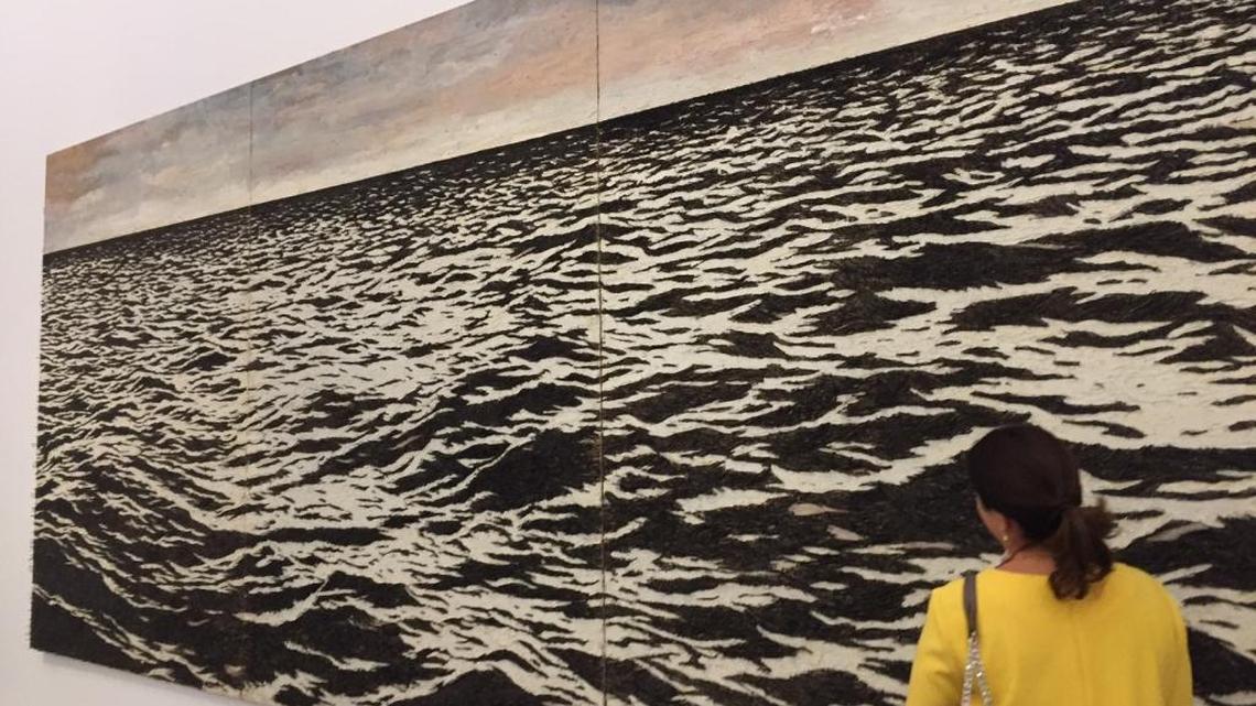 About 550,000 fish hooks were used to create Yoan Capote’s massive canvas of the sea, on display at the Perez Art Museum Miami.