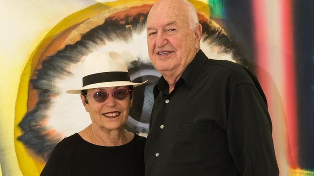 Mera and Don Rubell, founders of the Rubell Family Collection, in front of Kerstin Brätsch's painting “When You See Me Again It Wont Be Me” (from Broadwaybratsch/Corporate Abstraction series), 2010.