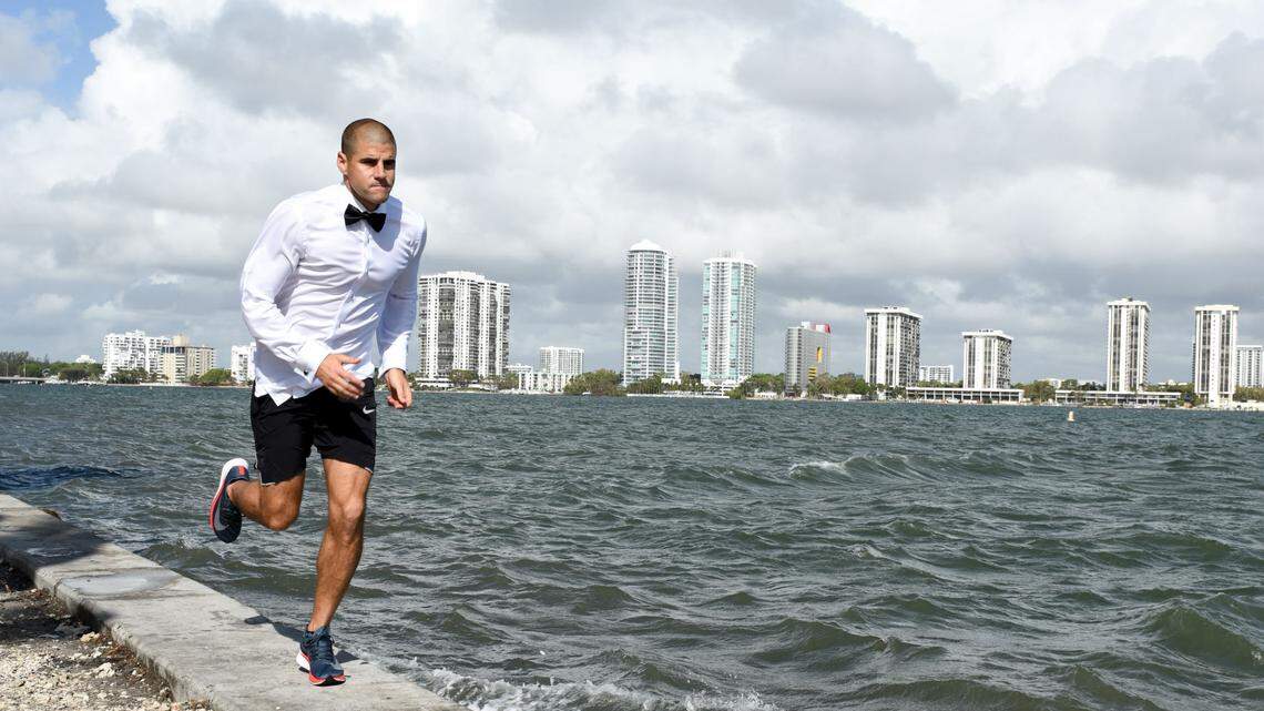 Frankie Ruiz runs across the Rickenbacker Causeway in his wedding tuxedo shirt and go-to Nike running shorts. Photograph by Carina Mask.