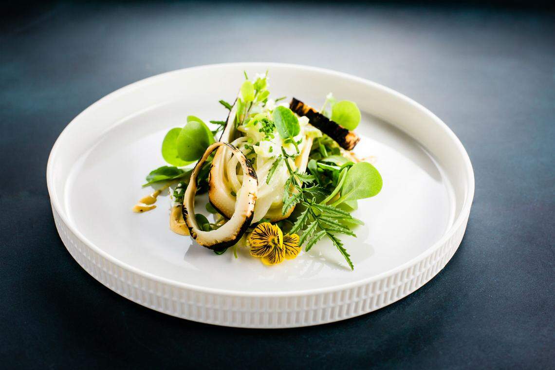 Grilled hearts of palm and squash salad at Three by Norman Van Aken. Photograph by Open i Studios.